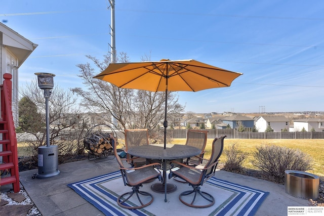 view of patio / terrace featuring outdoor dining space and fence