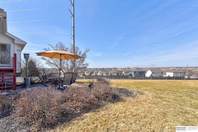 view of yard with a residential view and fence