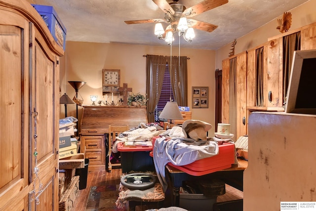 bedroom with ceiling fan and wood finished floors