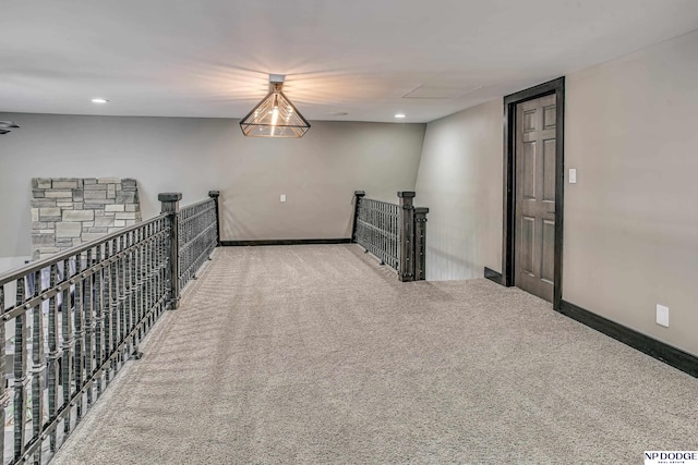 hall with recessed lighting, baseboards, an upstairs landing, and carpet flooring