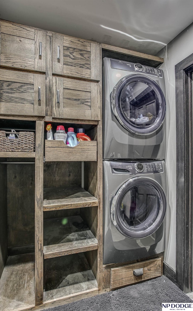 laundry room featuring laundry area and stacked washer and dryer