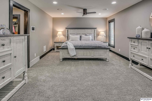 bedroom with recessed lighting, baseboards, and light colored carpet