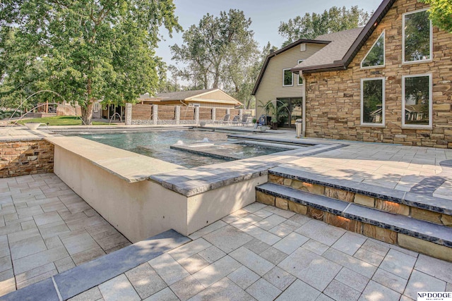 pool with a patio area