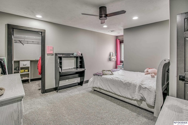 bedroom featuring recessed lighting, visible vents, carpet, and a textured ceiling