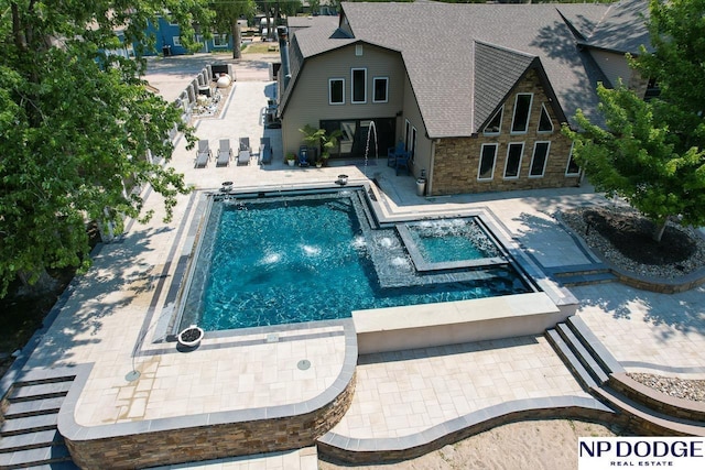 outdoor pool featuring a patio