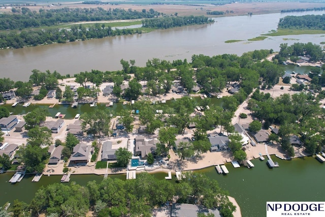 drone / aerial view featuring a residential view and a water view