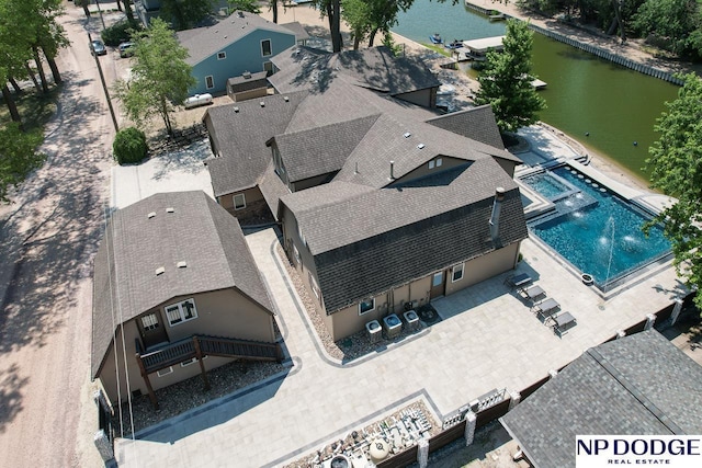 drone / aerial view with a water view