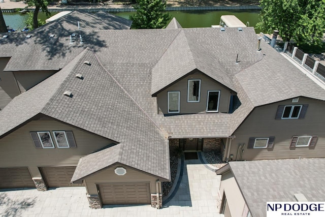 birds eye view of property featuring a water view