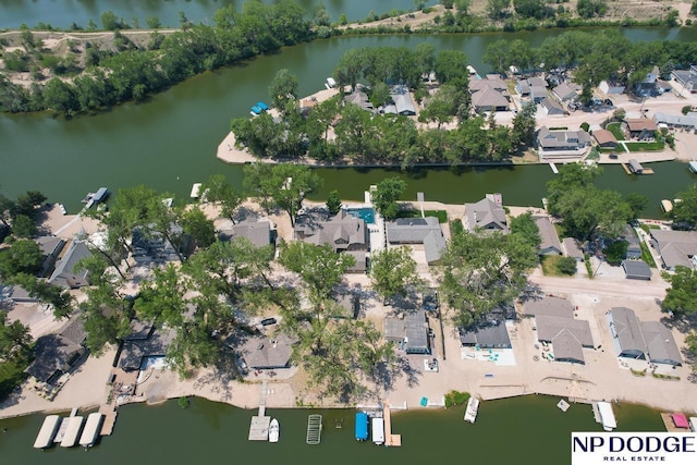 drone / aerial view with a residential view and a water view