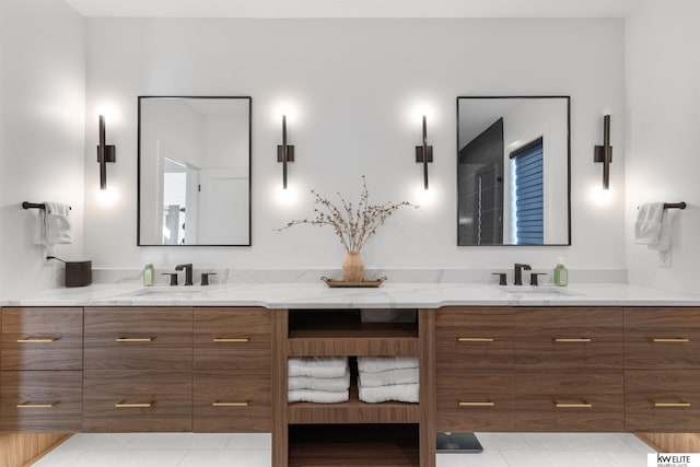 full bathroom featuring a sink and double vanity