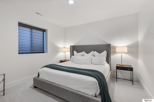 bedroom featuring visible vents, carpet flooring, and baseboards