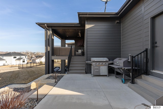 view of patio / terrace with area for grilling and fence