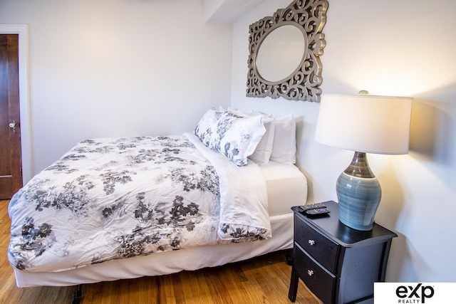 bedroom with wood finished floors