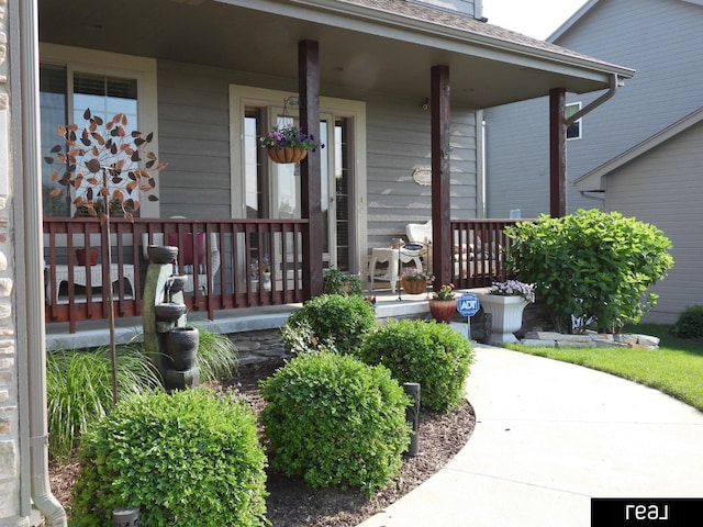 doorway to property featuring a porch