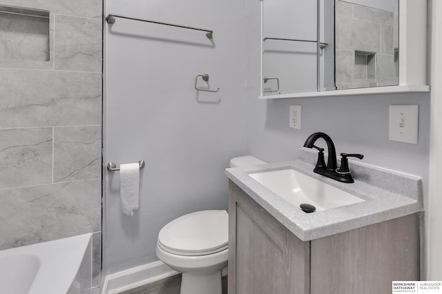 bathroom with toilet, a tub, baseboards, walk in shower, and vanity