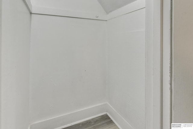 interior space with baseboards and wood finished floors