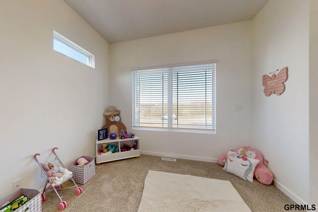 recreation room featuring visible vents, baseboards, and carpet flooring