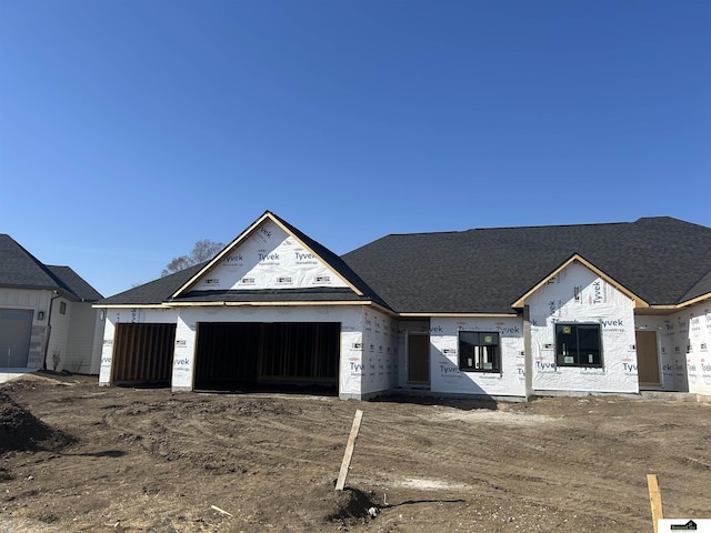 unfinished property with an attached garage