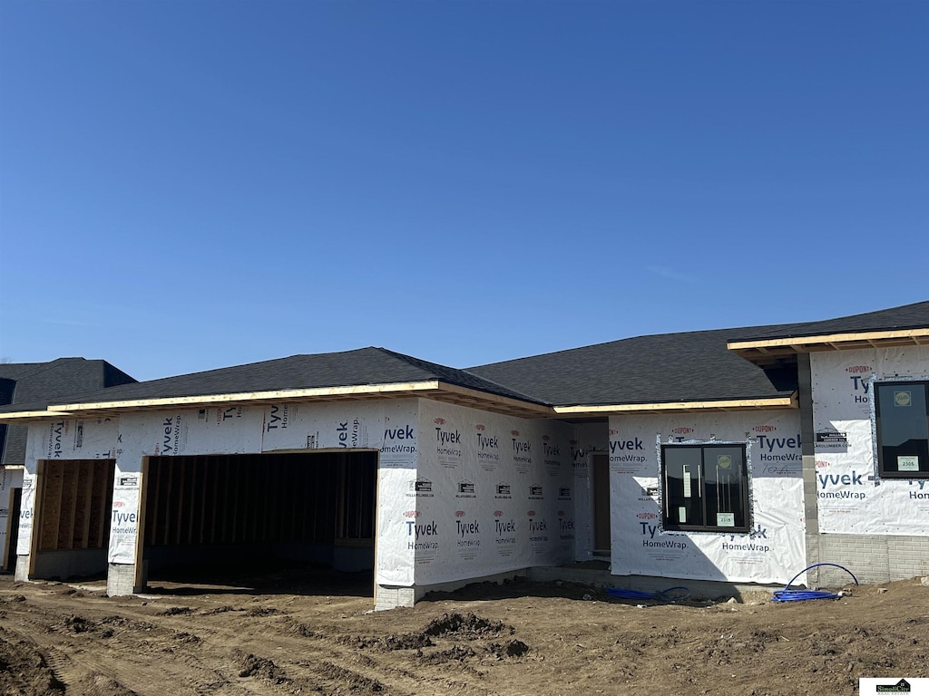 property under construction featuring an attached garage