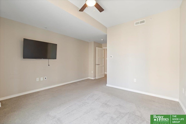 unfurnished room with a ceiling fan, carpet flooring, baseboards, and visible vents