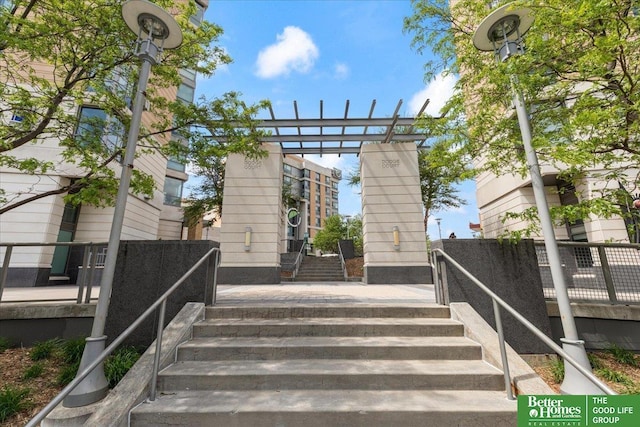 exterior space with a wooden deck and stairway