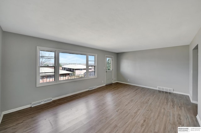 interior space featuring wood finished floors and visible vents