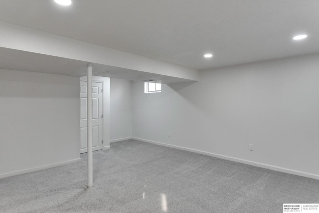 basement featuring visible vents, recessed lighting, baseboards, and light carpet