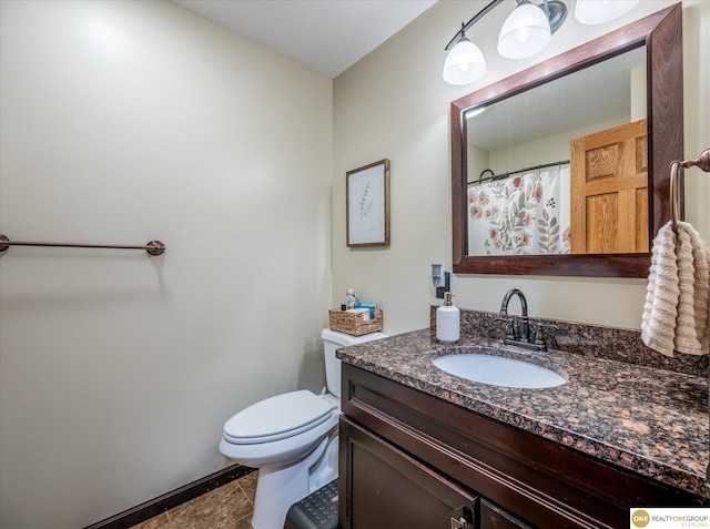 full bathroom featuring vanity, toilet, and tile patterned flooring