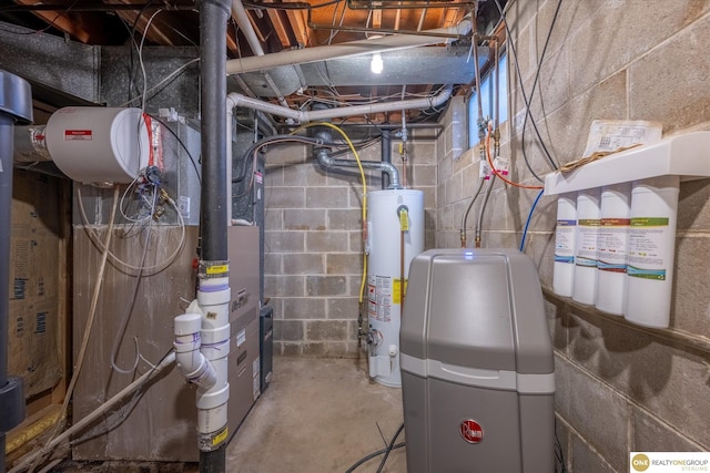 utility room featuring water heater