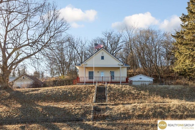 view of front of property featuring a porch and a chimney