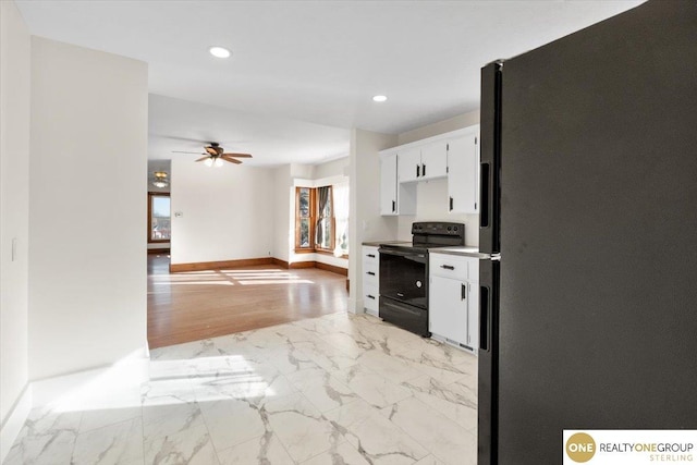 kitchen with marble finish floor, black appliances, recessed lighting, white cabinets, and ceiling fan
