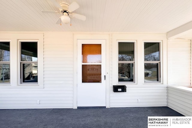 entrance to property with ceiling fan