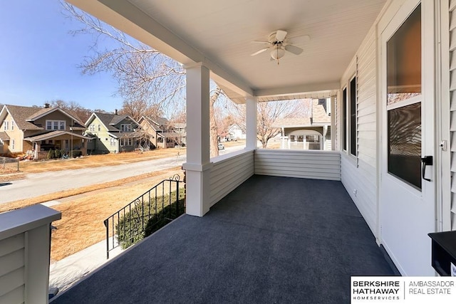 view of patio featuring a residential view, a porch, and ceiling fan