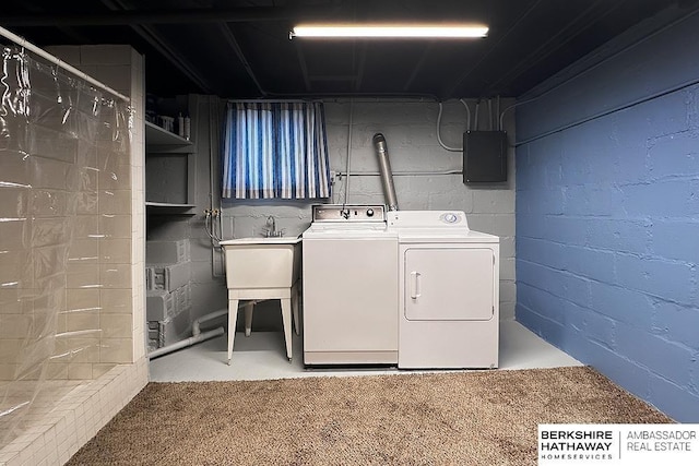 laundry area with laundry area, electric panel, and washer and clothes dryer