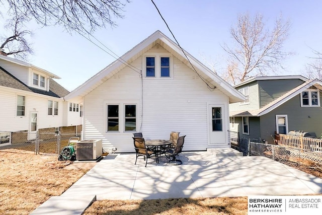 back of house featuring a patio area, central air condition unit, and fence