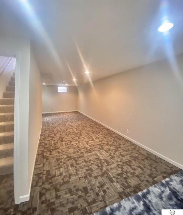 interior space featuring stairs and baseboards