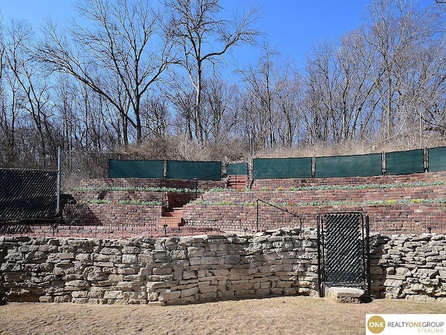 view of yard featuring a gate and fence