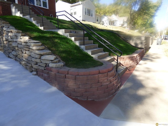 exterior space featuring stairway and a residential view