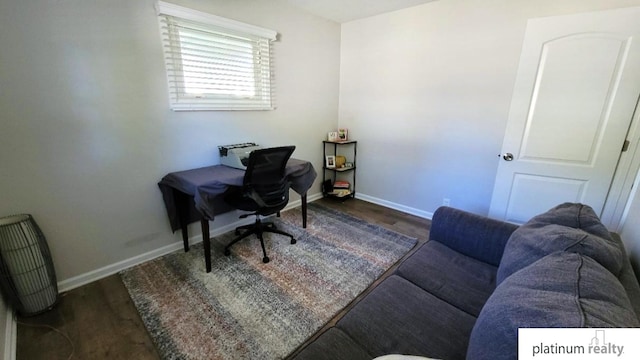 home office with baseboards and dark wood-style flooring