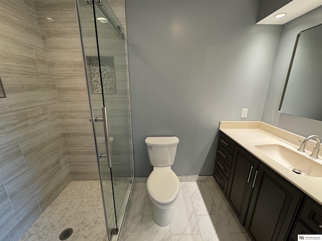 full bathroom with vanity, toilet, marble finish floor, and a stall shower