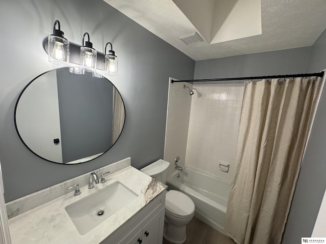 full bath featuring vanity, visible vents, shower / tub combo, a textured ceiling, and toilet