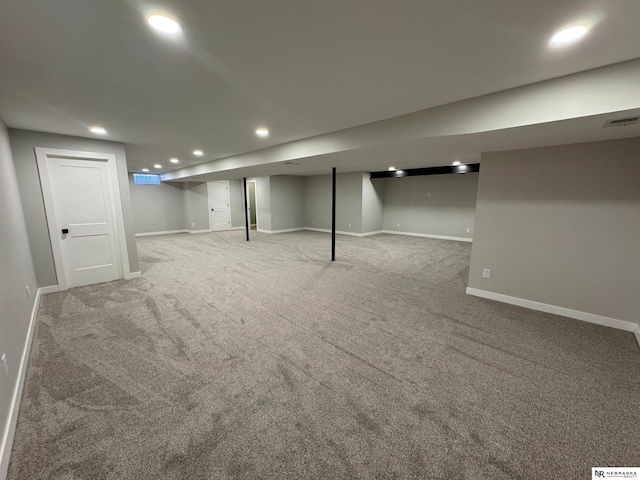 finished below grade area with recessed lighting, visible vents, baseboards, and carpet flooring