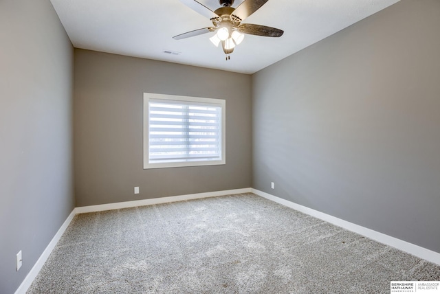 empty room with visible vents, baseboards, ceiling fan, and carpet floors