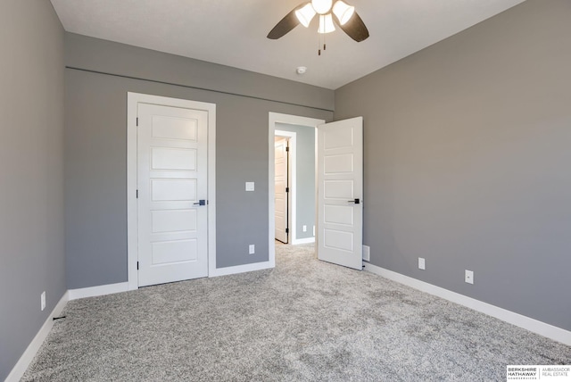 unfurnished bedroom with baseboards, visible vents, and carpet floors