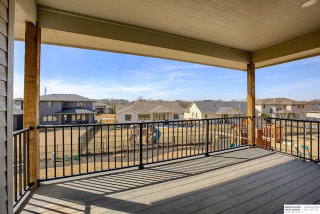 wooden deck with a residential view