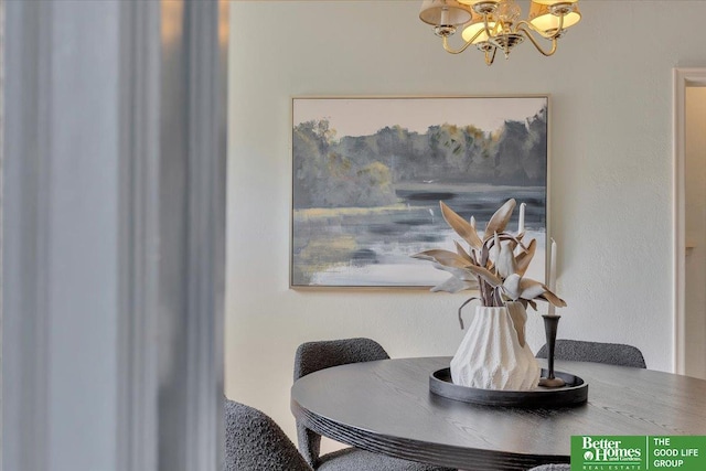 dining area featuring an inviting chandelier