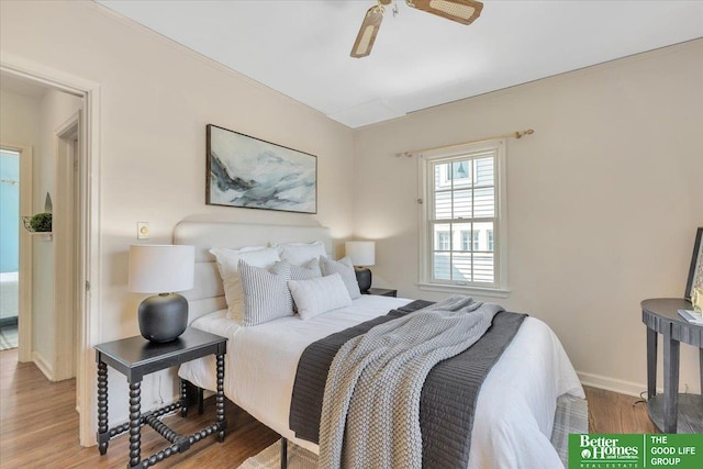 bedroom with ceiling fan, baseboards, and wood finished floors