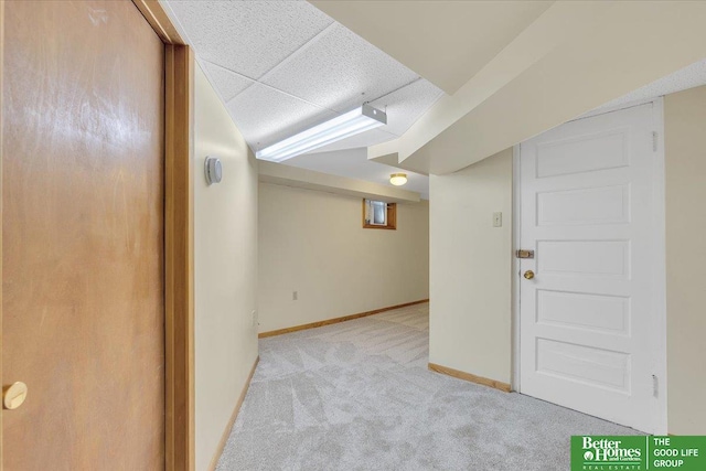 finished basement with baseboards and carpet floors