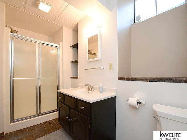 full bathroom featuring visible vents, toilet, a stall shower, and vanity