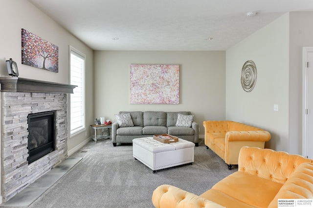 living room with carpet flooring, baseboards, and a fireplace